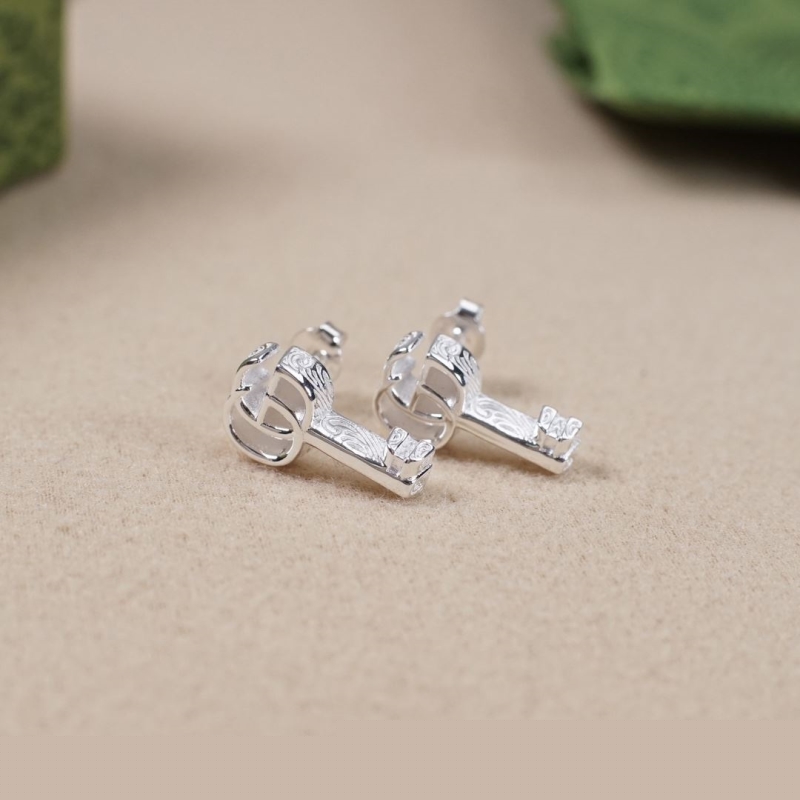 G*u*i earrings